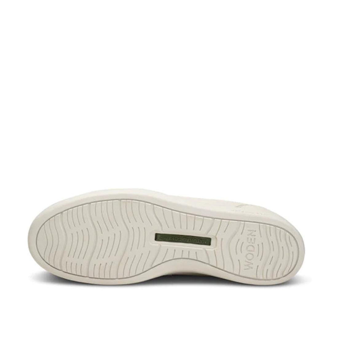 The Woden Bjork Women's Leather Sneaker Blanc de Blanc White features a wavy tread sole with the WODEN logo and a green rectangle, highlighting its sustainable design with fish leather accents., 5713326460865, 5713326460872, 5713326460889, 5713326460896, 