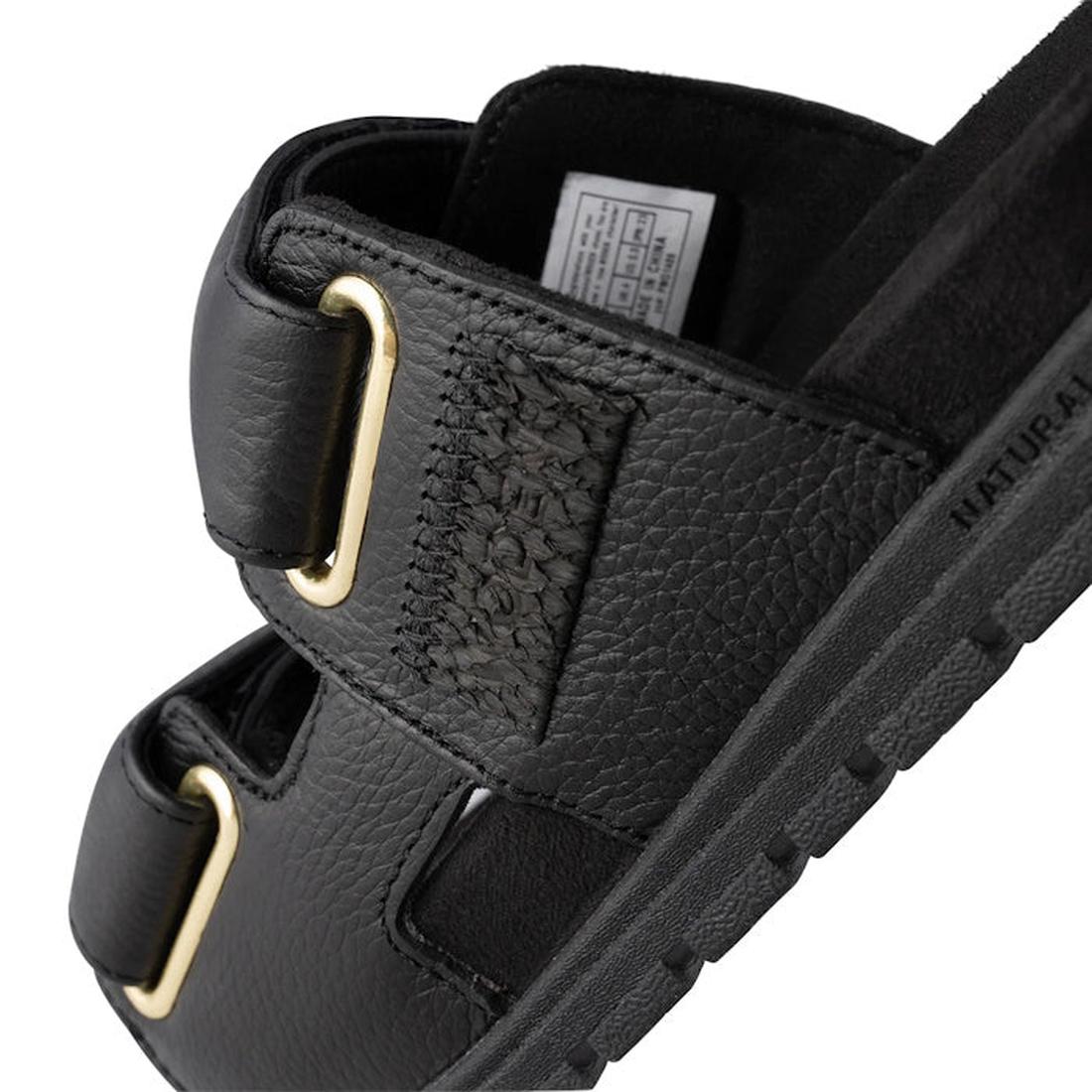 Close-up of the Woden Lisa Women's Leather 2 Strap Sandal in black, featuring chunky buckle straps, textured LWG-certified leather, visible stitching, a thick ridged sole, anatomical footbed, and an inside fabric label., 5713326518276, 5713326518283, 5713
