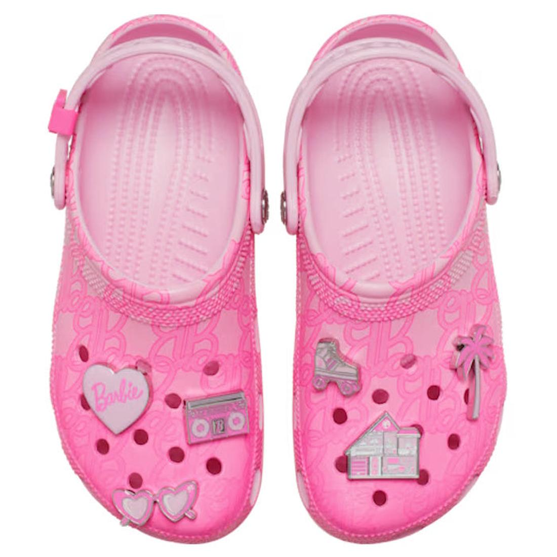 Pink women's crocs clogs sandals with decorative charms, top down view on a white background,
198445228803,
198445228810,
198445228827,
198445228834,, 45968, 198445228803, 198445228810, 198445228827, 198445228834, 45973, 45974