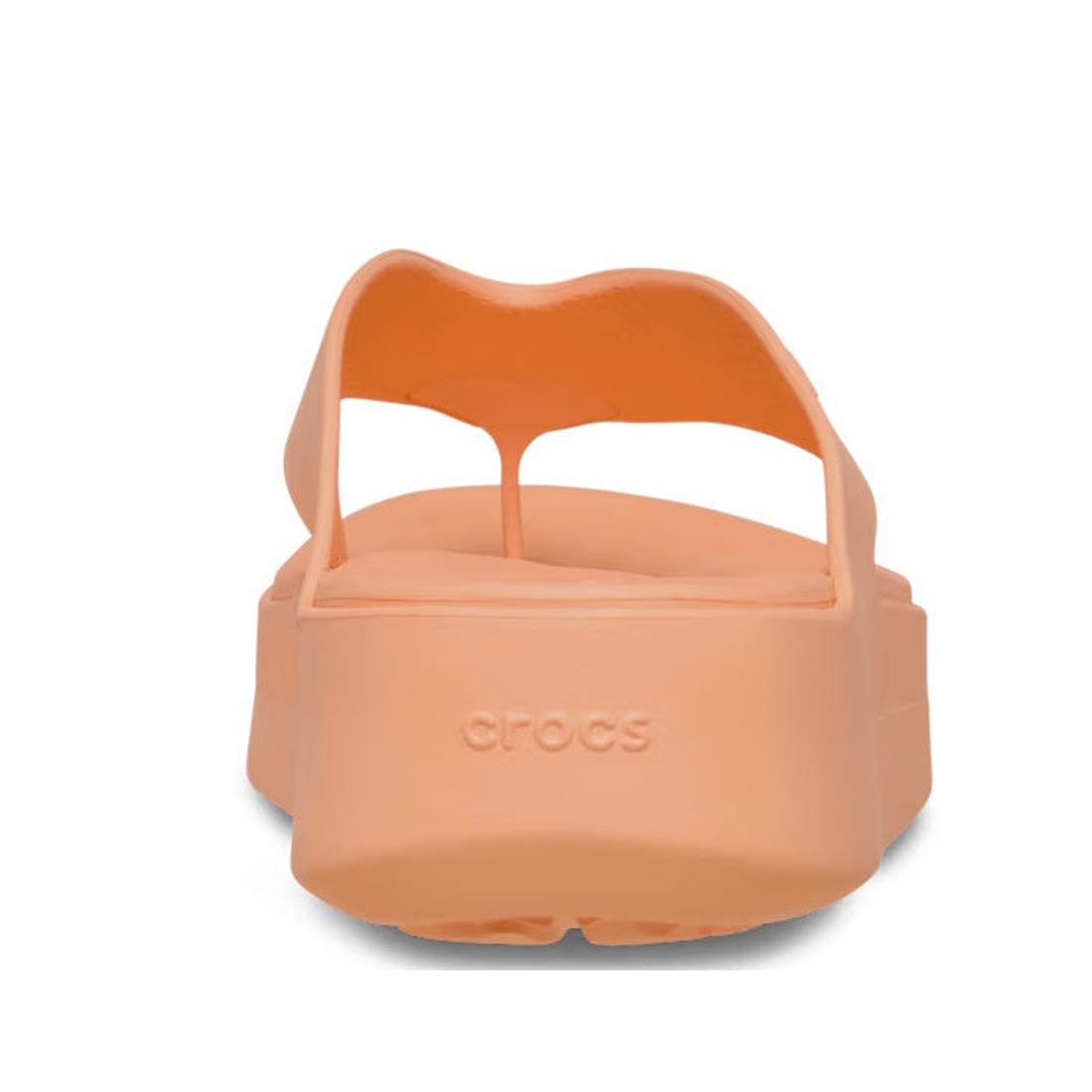 The Crocs - Womens Getaway PLATFORM Flip Sandal in Sunstone Orange features a peach-toned platform heel and Crocs logo on the back strap—making it the perfect stylish jandal from the Getaway Collection., 49910, 49911, 198445274329, 198445274336, 198445274