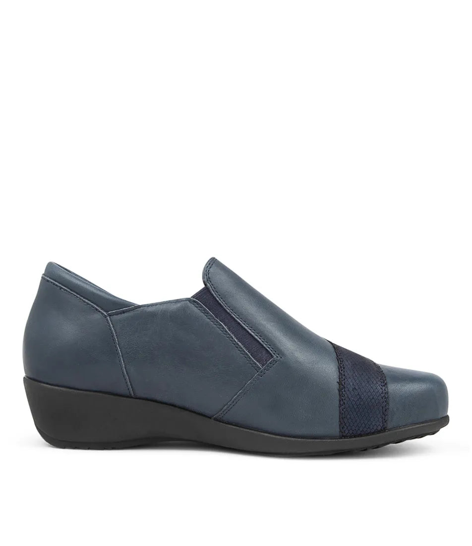 A side view of the Ziera Sage XF Women's Wedge Heel Shoe in navy leather, featuring a low black wedge heel, elastic side panels, textured toe band, zip closure, and high arch support., 50984, 4434755914682, 4434755914699, 4434755914705, 4434755914712, 443