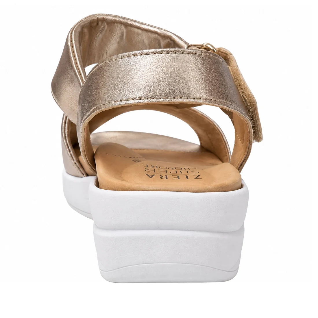 A close-up rear view of the Ziera Nazly2 Platino Gold White XW Women’s Leather Sandal, featuring a gold leather upper with an adjustable ankle strap and a thick white sole. The tan insole displays the Ziera Ultimate Comfort branding and is designed with h