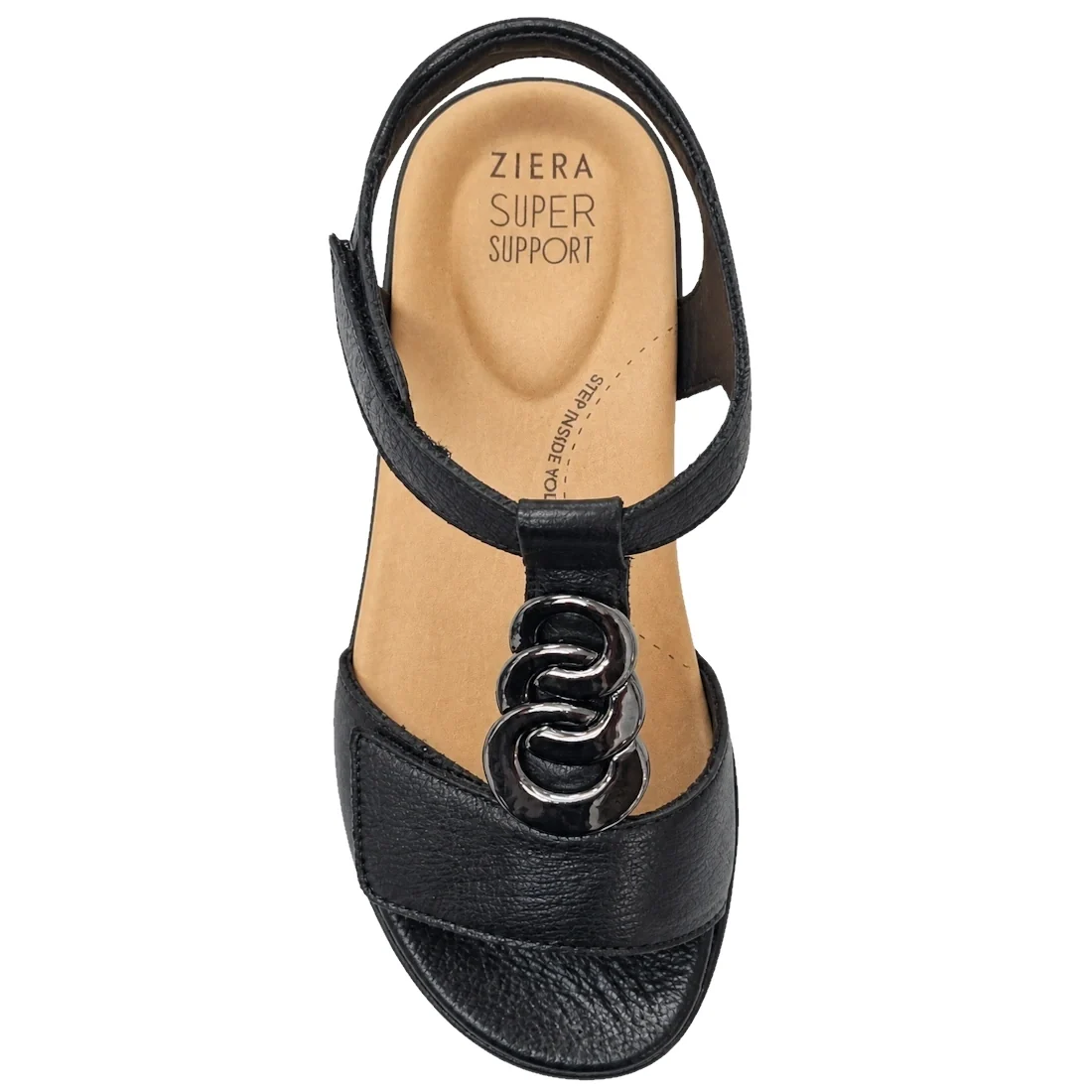 The Ziera Navvon Black XW Women’s Leather Slingback Sandal features a black open-toe design with a tan insole labeled Ziera Super Support. This sandal is adorned with a decorative metal chain on the front strap and includes a supportive heel strap, delive