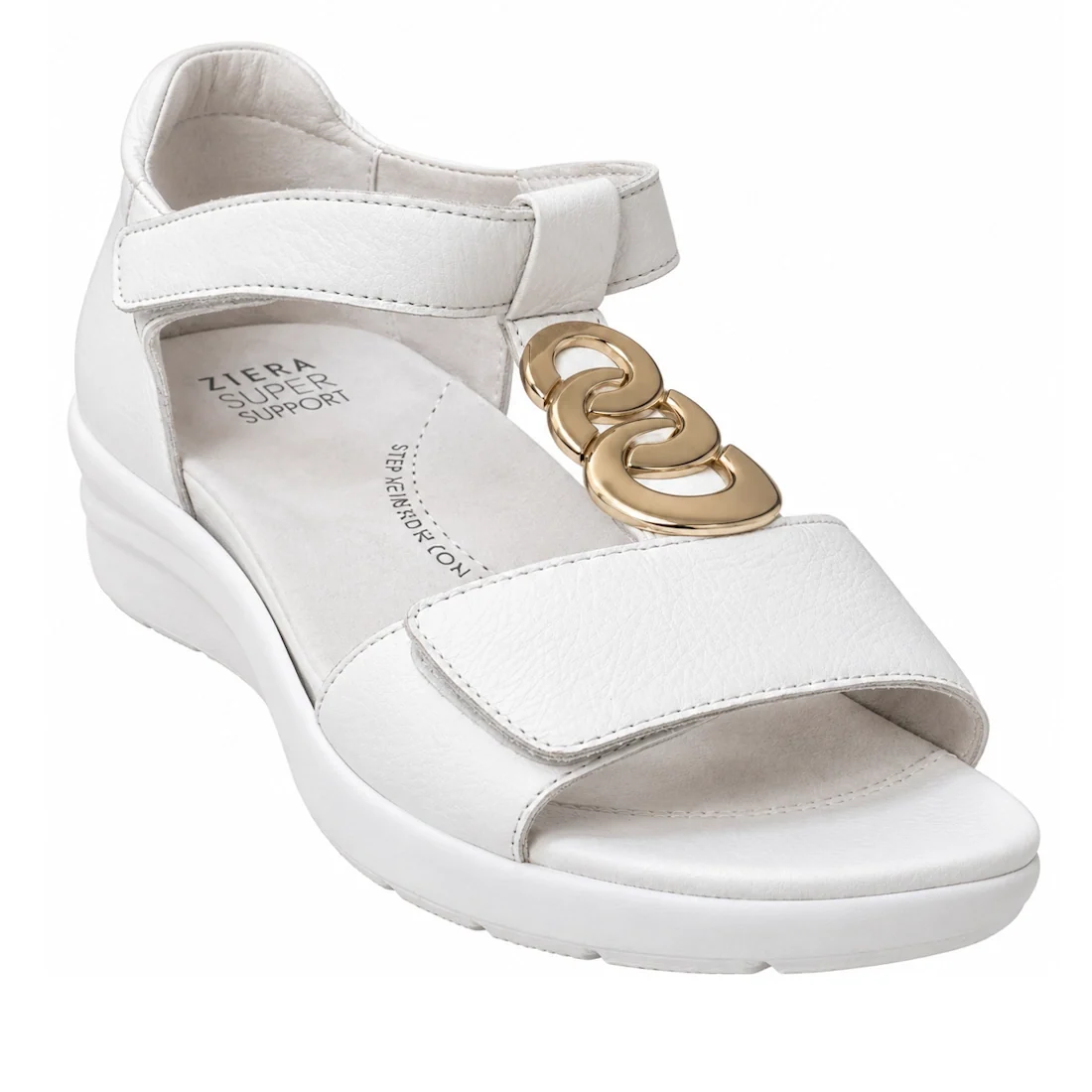 The Ziera Nextime White Women’s Leather Sandal XW Closed Back features a white leather upper with an open toe, thick sole, adjustable ankle strap, and gold chain embellishment. The insole displays the Ziera SUPER SUPPORT text and is designed for orthotic 